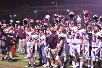 the team celebrates after the close victory over the Panthers