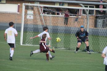 Sophomore Clayton Shuler goes for a goal against Hayesville. Shuler was named the Player of the Game.