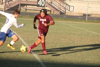 Maroon Devil James Sanchez battles it out with a Highlander in the home game Monday.