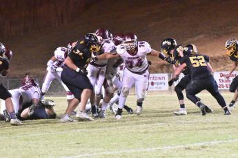 Maroon Devil defensive line prevents the Bulldogs from gaining yards with Ashton Baul on the tackle #58, and Nolan Fisher #74, Aiden Curtis #55, Braylon Aldridge #54 and Josiah Glaspie 13 clearing the Bulldogs line. 