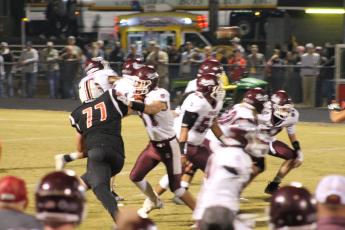 Maroon Devil Nathan Bogdanowicz and other defensive players going after the Andrews Wildcats.