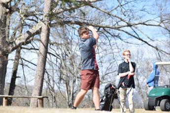 Swain County High golf team member Clay Seagle takes a swing competing in Robbinsville last week.