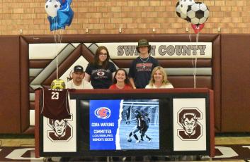 Lady Devil Cora Watkins signed to continue her soccer career with Louisburg College in a ceremony held at the Swain High gymnasium recently. She’s pictured with her family.
