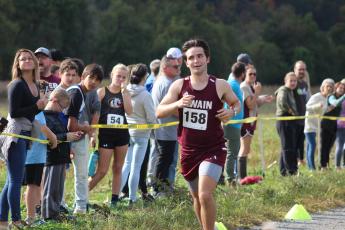Connor Lambert crosses the finish line at the Kituwah meet for the Smoky Mountain Conference on Saturday, Oct. 14.