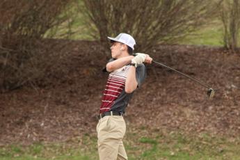 Maroon Devil golfer Jack Wilmont takes a swing at the game the Devils hosted at Smoky Mountain Country Club on Tuesday, March 5, where he scored 51 points overall.