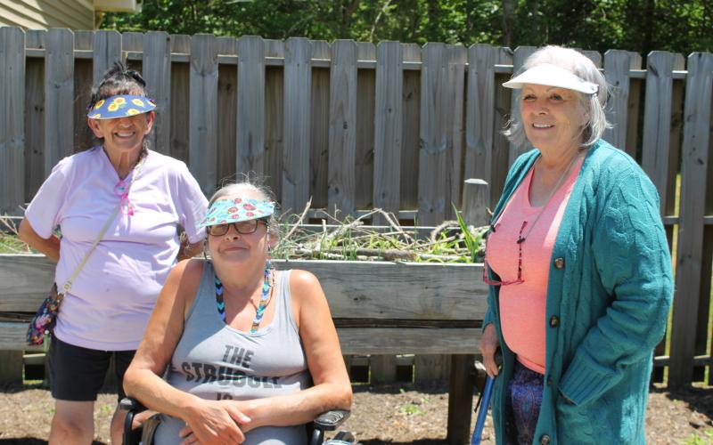From left, Bryson Senior Living residents Judy Bird, Deb Eng and Carolyn Queen, along with Rina Terry, asked for the garden and quickly got to work making it a reality, planting seedlings and watering the beds. 