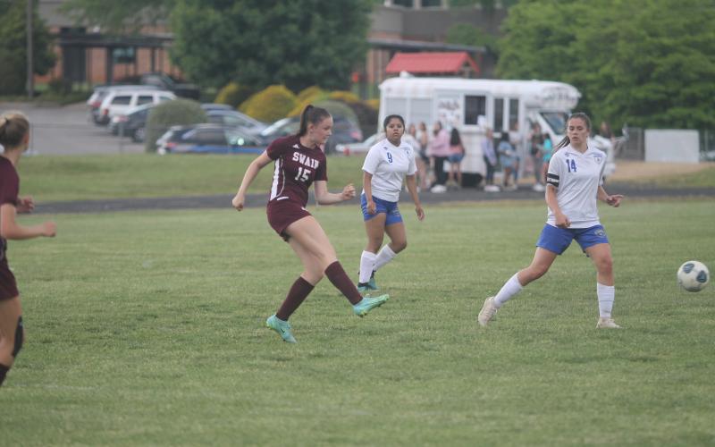 Karena Cline passes to Helpman for another goal by the pair during the game