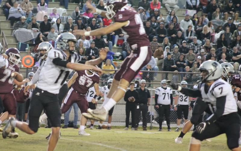 Cole Wikle soars over a Robbinsville player in a catch attempt.
