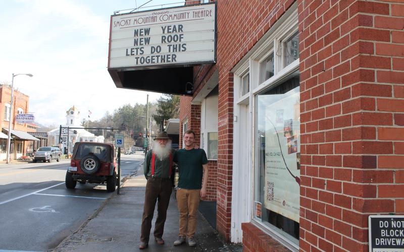 Smoky Mountain Community Theatre repairs liaison Tim Hall (left) stands with theater Board of Directors President Ricky Sanford outside the iconic downtown location, which recently had roof repairs finished.