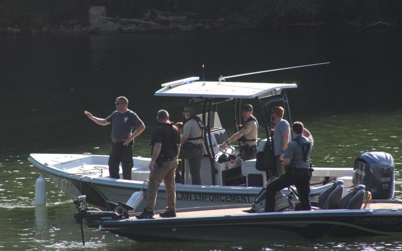A team of emergency services personnel combed the Little Tennessee River where it feeds into Lake Fontana on Thursday, searching for two men who they discovered had drowned.”
