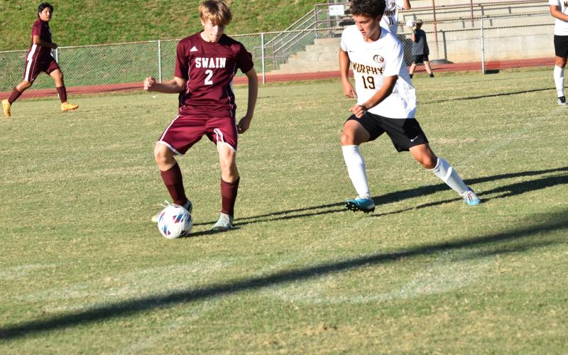 Maroon Devil Clayton Shuler, junior, gains control of the ball in the home tie against the Murphy Bulldogs. The next game is Monday at Andrews.