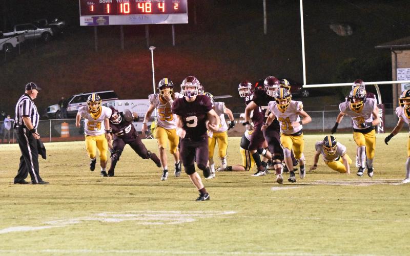 Josh Collins runs with the ball at the home game against Murphy on Friday, Oct. 13. The Maroon Devils won the game by 37-13 and are still undefeated. Collins has been doing well with rushing this season – he ran 265 yards over 23 carries this game, his third game in a row where he ran more than 200 yards.