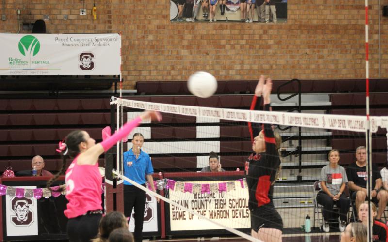 Lady Devil Gracie Sutton spikes the ball at the game against Andrews on Thursday, Oct. 12, which the Devils won 3-0.