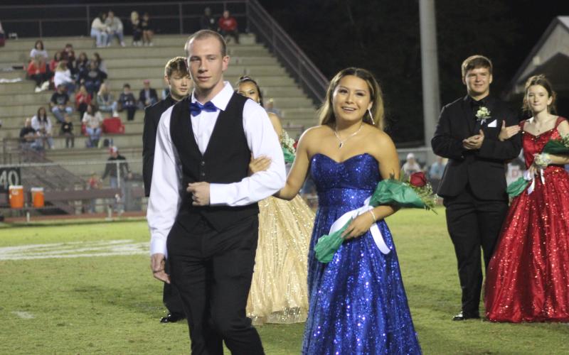 Junior Isabella Walker (right) got Maid of Honor for this year’s Homecoming, appearing at the Sept. 29 home football game escorted by Daniel Nations.