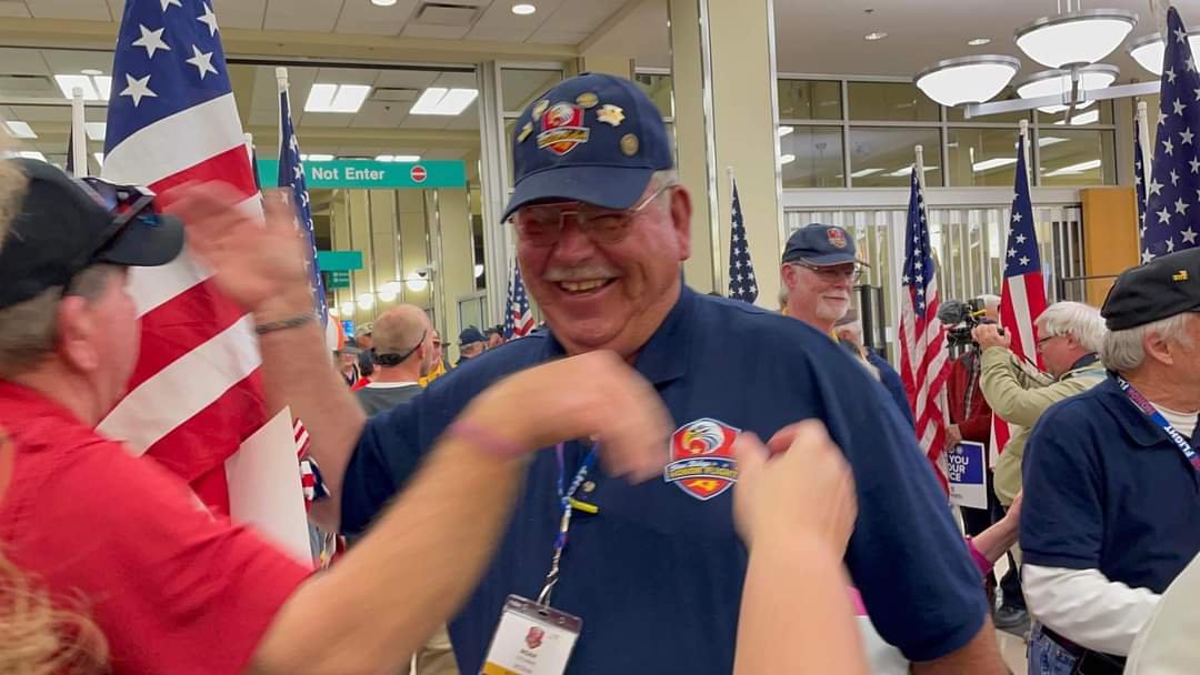 Swain County's Max Cochran, a Vietnam Veteran, gives a friend a high-five as he and the other veterans returning to the Asheville Airport after taking part in the Blue Ridge Honor Flight from Washington D.C. Other Swain County veterans participating included: Don Moon, Jack Webb, Ernie Panther and David DeHart. 