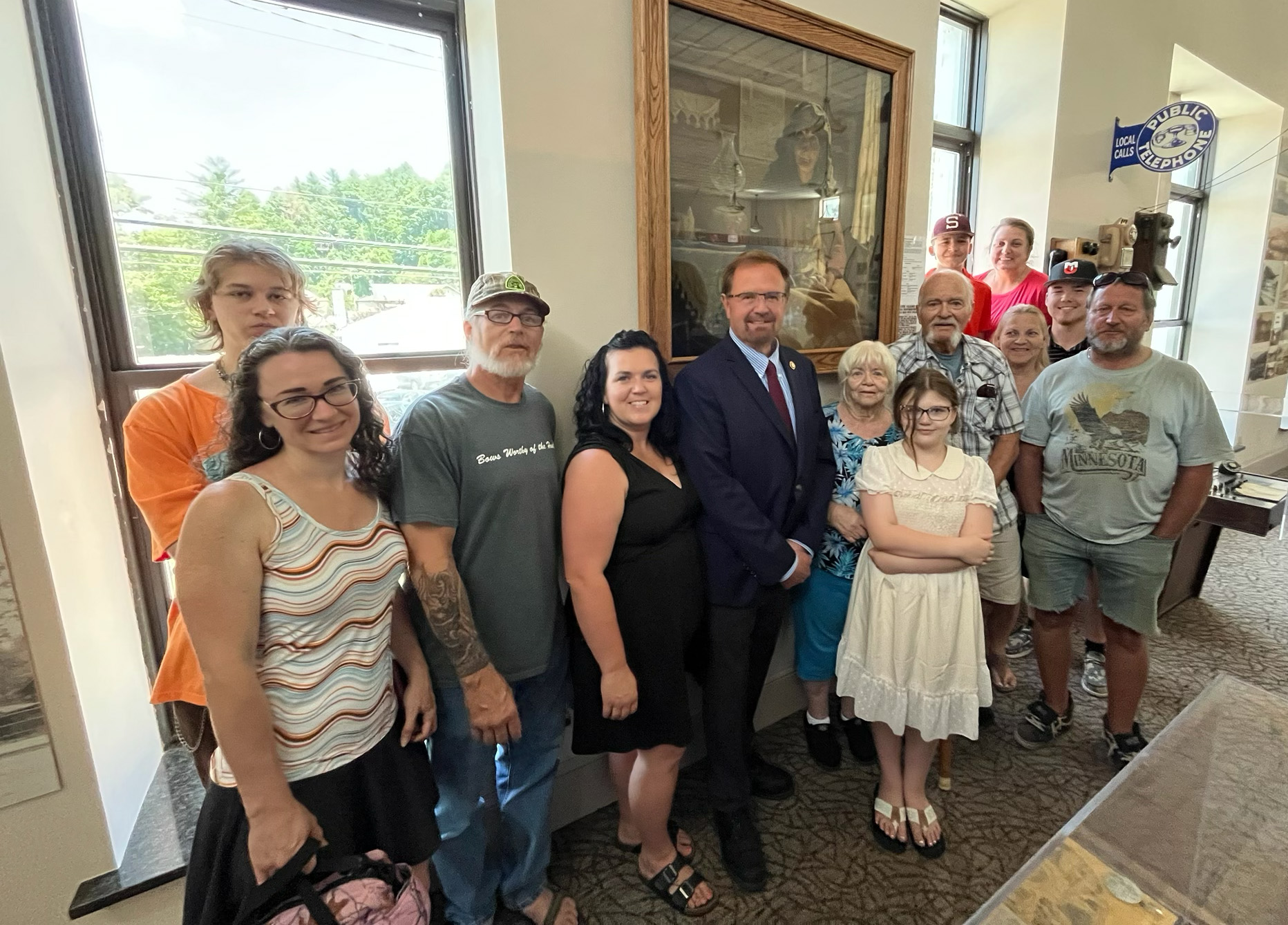 Members of the Winchester family are pictured at the Swain Heritage Museum with Congressman Chuck Edwards in front of the portrait titled "Matriarch of the Smokies" depicting Mary Magdaline Ridley Winchester that is on loan from the National Park Service.  Lake Silver/Special to SMT