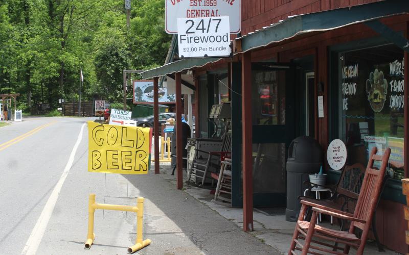 A handwritten sign outside Deep Creek Store that was annexed into Bryson City town limits last year advertises the store now sells ‘Cold Beer.’
