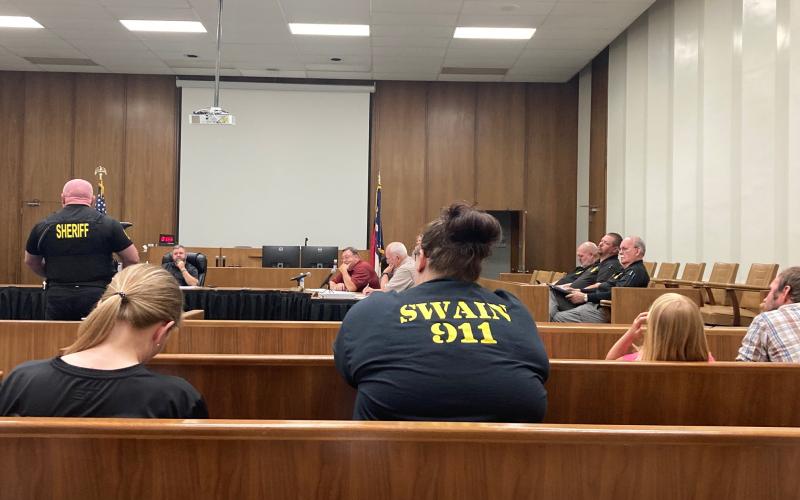 Swain County Sheriff’s Department Lieutenant Scott Barnes speaks before the commissioners about the need to increase wages for county employee